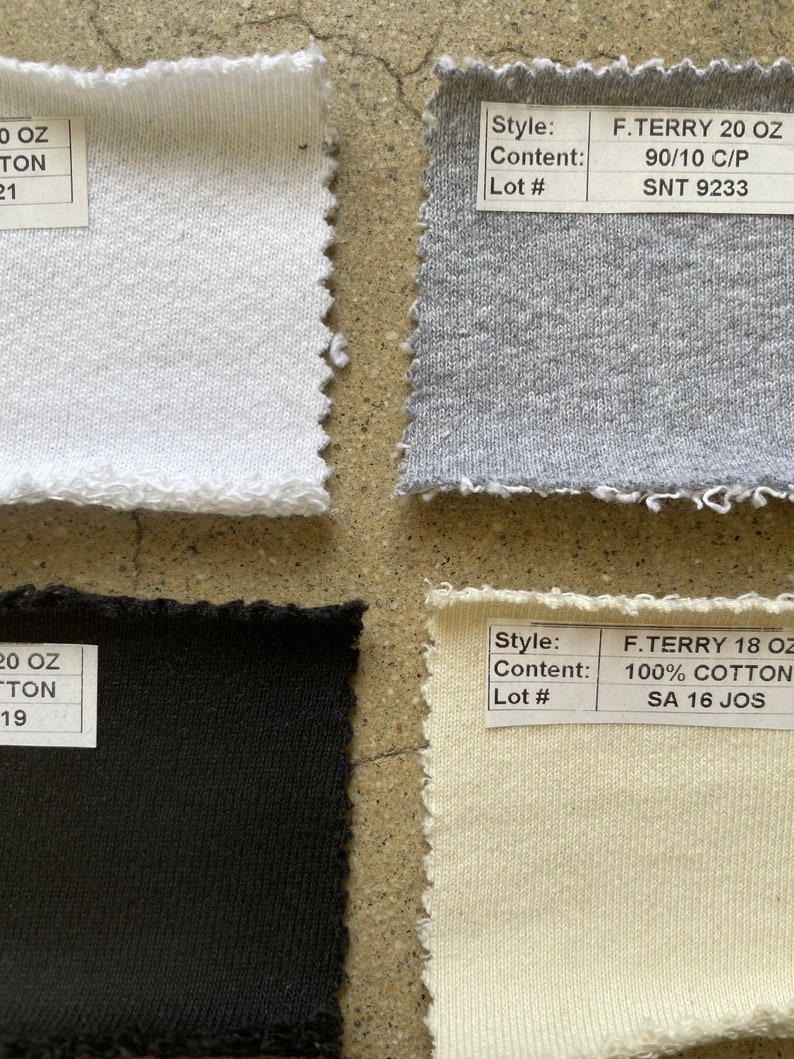 May include: Four fabric swatches, two white, one gray, and one beige. The swatches are labeled with the style, content, and lot number. The white swatches are labeled "F. TERRY 20 OZ 90/10 C/P SNT 9233" and "F. TERRY 18 OZ 100% COTTON SA 16 JOS". The gray swatch is labeled "F. TERRY 20 OZ 90/10 C/P SNT 9233". The beige swatch is labeled "F. TERRY 18 OZ 100% COTTON SA 16 JOS".
