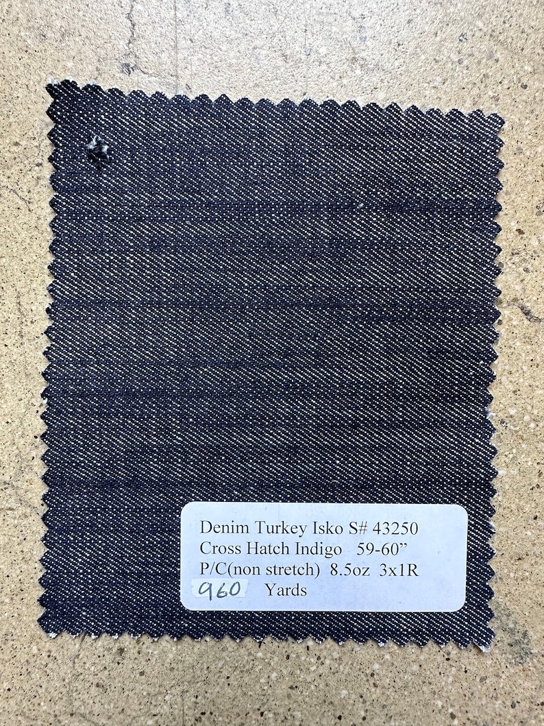 May include: A dark blue denim fabric swatch with the text "Denim Turkey Isko S# 43250 Cross Hatch Indigo 59-60" P/C(non stretch) 8.5oz 3x1R 960 Yards".