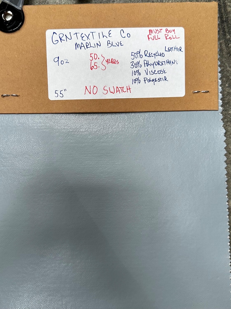May include: A sample of blue fabric with a brown label that reads "GRNTEXTILE Co MARLIN BLUE" and includes the following information: 9 oz, 50-65 yards, 50% Recycled Leather, 30% Polyurethane, 10% Viscose, 10% Polyester, MUST BUY FULL ROLL, 55" NO SWATCH.