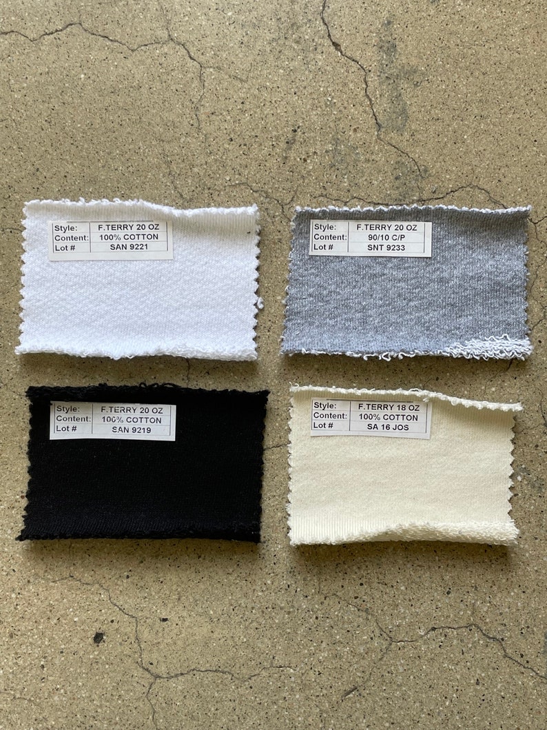 May include: Four fabric swatches with labels showing the style, content, and lot number. The swatches are white, gray, black, and off-white.