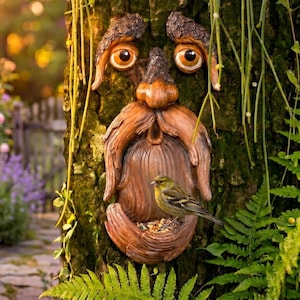 May include: A whimsical tree face bird feeder carved into a tree trunk. The face has large, expressive eyes and a long beard, with a small bird perched on the feeder filled with seeds. The feeder is brown and blends with the tree's bark.