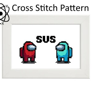 May include: Cross stitch pattern featuring two Among Us characters, one red and one blue, facing each other with the word "SUS" in between them.