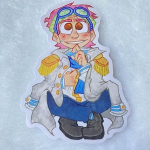 May include: A cartoon sticker of a character with pink and green hair wearing a white and blue uniform with gold accents. The character has blue goggles and is smiling.
