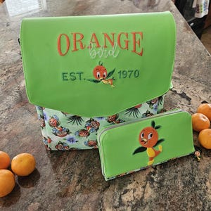 Mochila/cartera Orange Bird. Viaje a Disney, multiusos, bolsillos, ranura para botella de agua, personalizable.