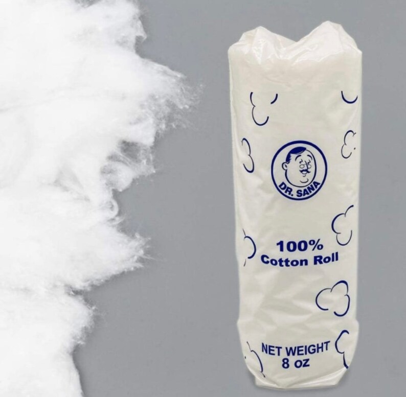 May include: A white cotton roll in a clear plastic package with blue accents. The package features the text "DR. SANA" and "100% Cotton Roll." The net weight is 8 oz. Loose cotton is visible to the left.