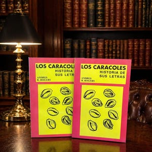May include: Two books titled "LOS CARACOLES HISTORIA SUS LETRAS" and "LOS CARACOLES HISTORIA DE SUS LETRAS" by Andres R. Rogers. The books have pink covers with yellow rectangles and black illustrations. The background includes a library with bookshelves and a table.