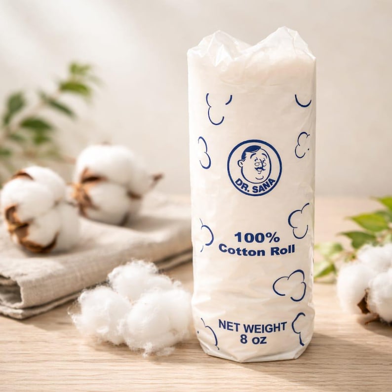May include: A white cotton roll package with blue accents and the text "Dr. Sana 100% Cotton Roll." The package is cylindrical and contains fluffy white cotton. The net weight is 8 oz. Cotton bolls are in the background.