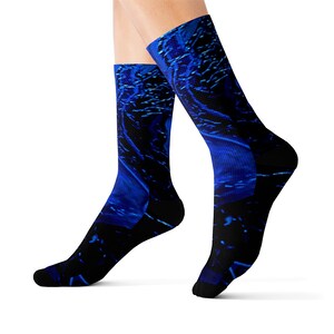 May include: A pair of blue and black socks with a swirling abstract pattern. The socks are made of a soft, comfortable material and are perfect for everyday wear.