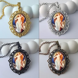 May include: Four oval pendant necklaces featuring a classical painting of a nude woman with red hair and attendants. The pendants are set in ornate frames with gold, silver, black, and bronze finishes, each suspended from a matching chain.
