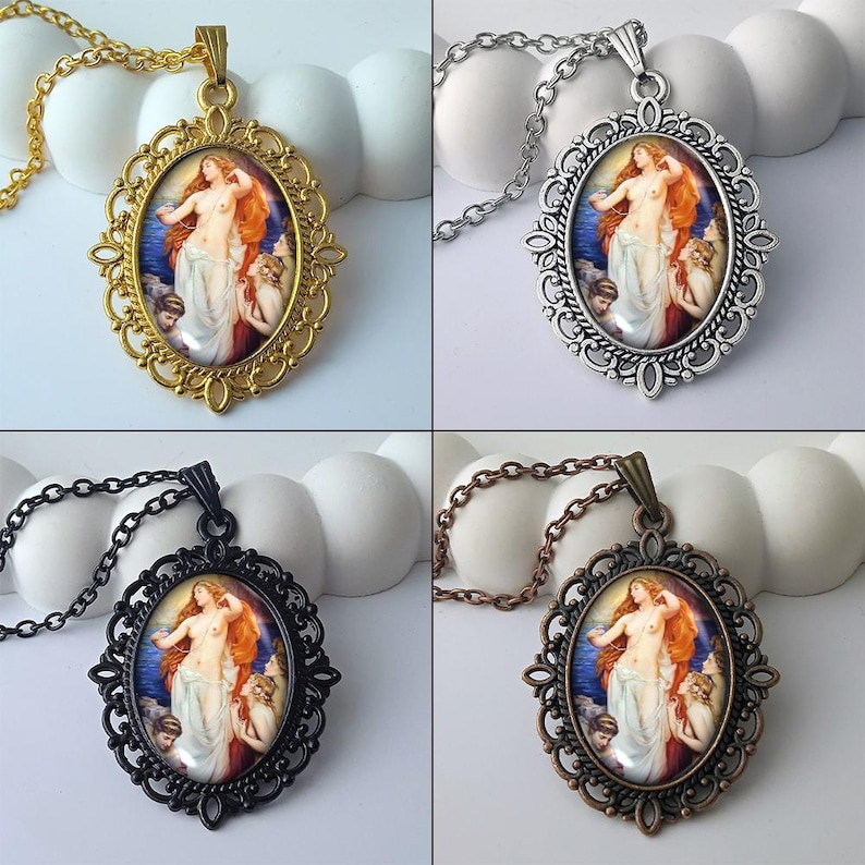 May include: Four oval pendant necklaces featuring a classical painting of a nude woman with red hair and attendants. The pendants are set in ornate frames with gold, silver, black, and bronze finishes, each suspended from a matching chain.