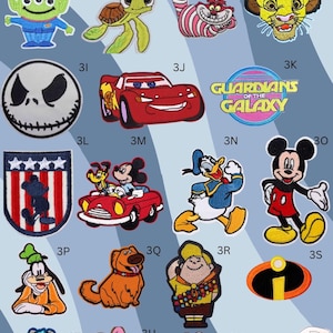 May include: A selection of embroidered patches showcasing cartoon characters from Toy Story, Disney, and Marvel. The patches are vibrant and detailed, in various shapes and sizes. Some patches include text, such as "SOLD OUT" and "GUARDIANS OF THE GALAXY".