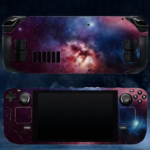 May include: A handheld gaming console with a galaxy-themed design. The console has a black and silver color scheme and features a large screen, two analog sticks, and a variety of buttons.