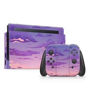 May include: A Nintendo Switch console and controllers with a purple sky and cloud design. The design covers the console and the controllers. The controllers have black grips and buttons. The sky design has shades of purple, pink, and white.