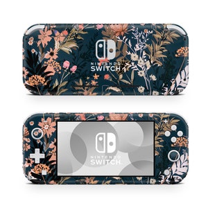 May include: A Nintendo Switch Lite console with a floral pattern. The console has a dark teal base, adorned with pink, peach, and cream-coloured flowers and foliage. The Nintendo Switch logo is displayed on the screen and the back of the console.