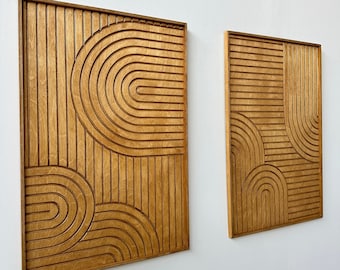 May include: Two wooden wall art pieces with a geometric design of curved lines and a wood grain finish.
