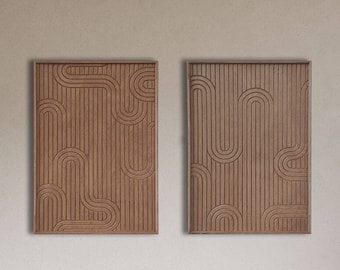 May include: Two brown wooden wall art pieces with a geometric pattern of lines and curves. The art is hanging on a light beige wall above a brown leather chair and a wooden side table with a white ceramic sculpture.