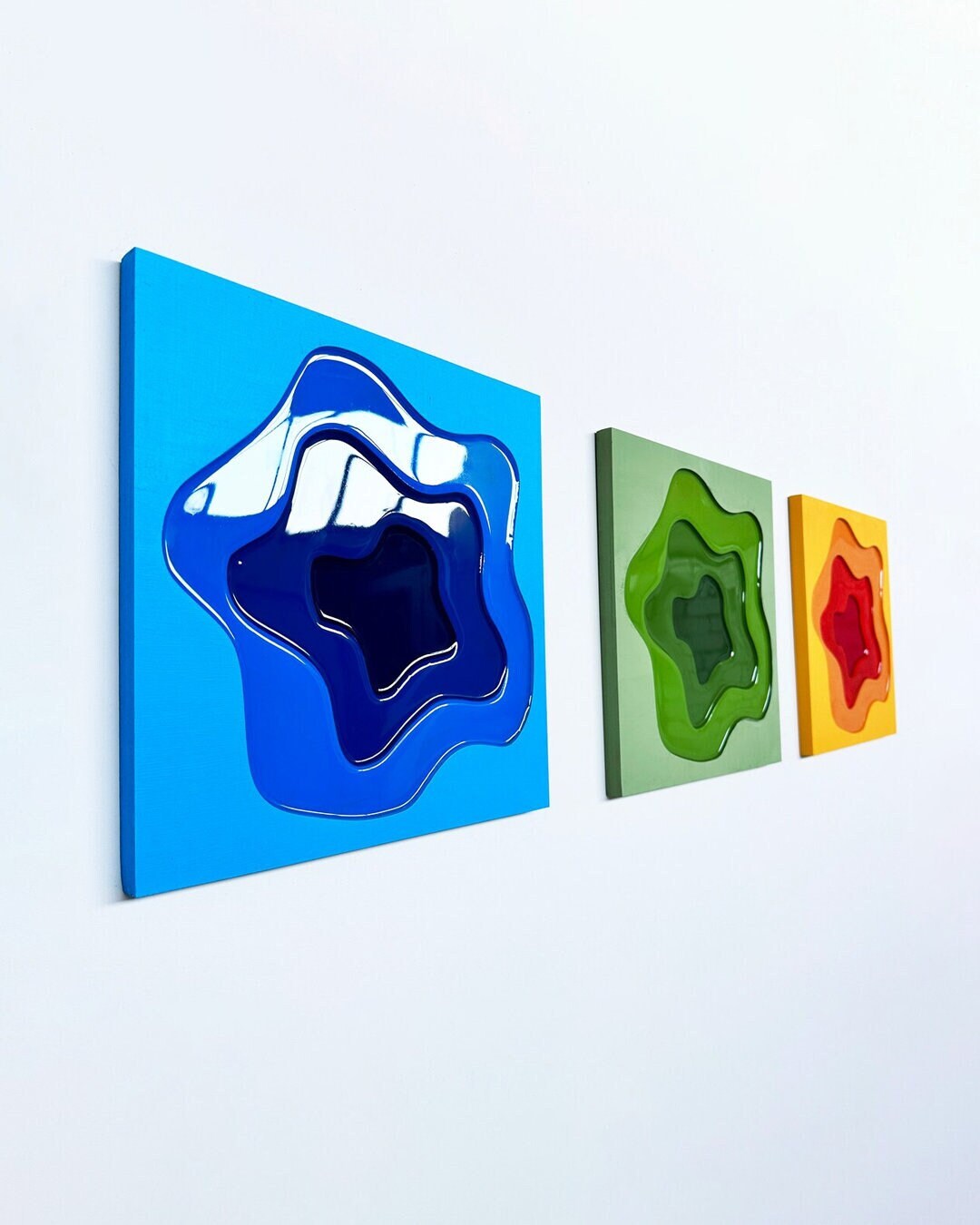 Art paintings consisting of glossy epoxy resin surface, hand-painted wood layers. Create your own art wall with the colors of your choice!