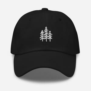 May include: A black baseball cap with a white embroidered design of three pine trees.
