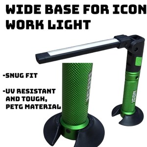 May include: Green and black work light with the text "WIDE BASE FOR ICON WORK LIGHT". The light has a wide base and is made of UV-resistant PETG material. The light is designed for a snug fit.