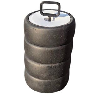 May include: A black weightlifting bumper plate with a white center and a black handle. The bumper plate is made of rubber and is designed for use in weightlifting exercises. The handle is made of metal and is attached to the top of the plate.