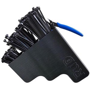 May include: A black plastic organizer filled with black cable ties. A pair of blue-handled wire cutters rests on the edge. The organizer has the letters "RUD" printed on the side.