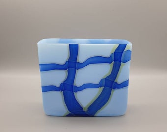 Monica Backström for Kosta Boda. A White Opaque Glass Vase with Blue and Yellow Trail Overlay. Signed to base.