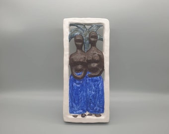 Svend Nielsen (1908-2003) for Søholm of Denmark. A Glazed Ceramic Wall Plaque of a Couple in a Tropical Scene. 1950s.