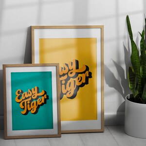 Easy Tiger Retro Halftone Word Art Print in Turquoise and yellow framed examples, Easy Tiger Retro Halftone Word Art Print,  Bold and Bright Typographic Art Print,  Funny Tiger Quote Print. Fun Tiger Wall Art