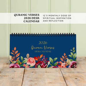 May include: A 2026 desk calendar with a navy blue cover featuring floral artwork and the text "Quran Verses." The calendar includes the text "12 X MONTHLY DOSE OF SPIRITUAL INSPIRATION AND REFLECTION."