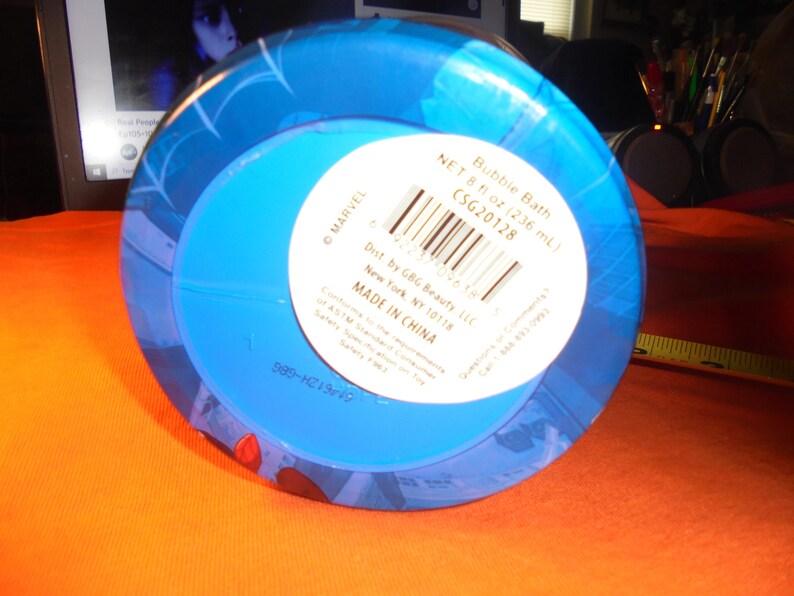 May include: A blue bubble bath container with a white label. The label includes the text "Bubble Bath" and "NET 8 fl oz (236 ml)". The container has a blue design and the text "MADE IN CHINA".