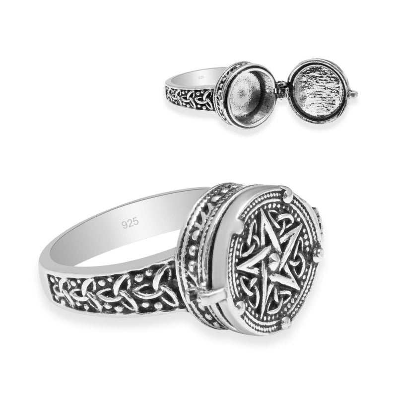 Peut inclure: Bague en argent avec un compartiment &agrave; charni&egrave;re, orn&eacute;e d'un motif de n&oelig;ud celtique sur le bandeau et d'un pentagramme dans un cercle sur le m&eacute;daillon. La bague est marqu&eacute;e "925".