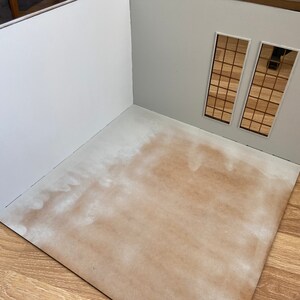 May include: A white room with a brown floor and two windows with a grid pattern. The room is empty and ready for decorating.
