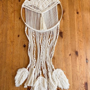 Macrame wall handing. Macrame dreamcatcher. Family symbol