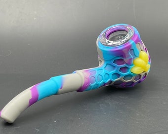 Silicone tobacco pipe with bottom compartment.