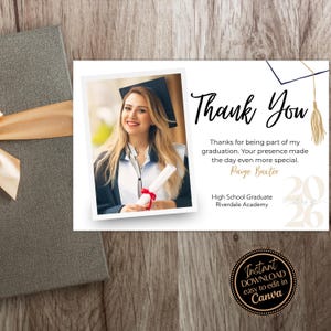 May include: A graduation thank you card with a photo of a graduate in a cap and gown. The card says "Thank You" and includes the graduate's name and school. The card is designed to be edited in Canva.