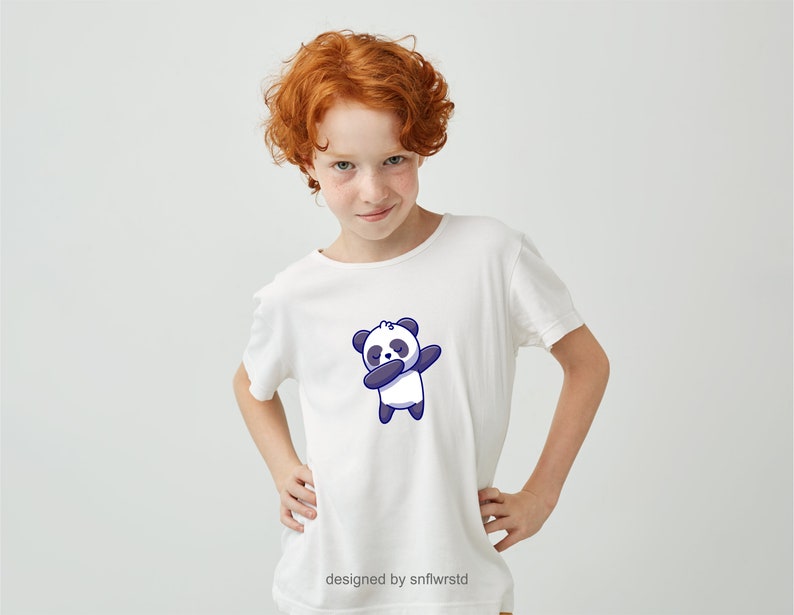 May include: A white t-shirt featuring a cartoon panda bear wearing a blue headband and performing a dabbing pose. The text "designed by snflwrstd" is at the bottom of the shirt.
