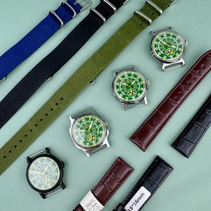 Puede incluir: Un surtido de correas de reloj y relojes. Las correas son de nailon azul, negro y verde oliva, y de cuero marr&oacute;n y negro. Los relojes tienen esferas verdes y blancas con cajas plateadas. Una correa est&aacute; etiquetada "18*16mm".