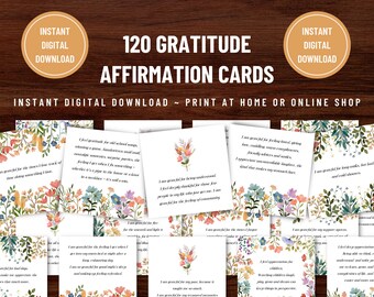 May include: 120 printable gratitude affirmation cards with floral illustrations. The cards feature a variety of watercolour flowers and greenery in shades of pink, blue, green, and yellow. The text on the cards is in a handwritten font and includes phrases like "I am grateful for the times I lose track of time doing something I love." and "I am grateful for feeling loved giving time, cuddling, warm cosy evenings, friendly smiles and smiles, genuine unconditional laughter, the kind that makes my stomach hurt."