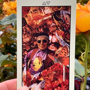 May include: A tarot card featuring a collage of a man in sunglasses, a butterfly, and crystals. The card is labeled "King of Coins" at the bottom. The background includes a collage of orange and brown crystals and a butterfly.