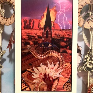 May include: A tarot card with a collage design. The card features a tower struck by lightning, a snake, and a hand holding flowers. The card is labeled "XVI" at the top and "The Tower" at the bottom. The background is a desert landscape.
