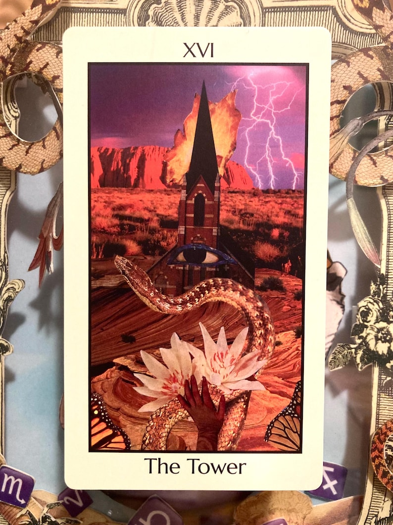 May include: A tarot card with a collage design. The card features a tower struck by lightning, a snake, and a hand holding flowers. The card is labeled "XVI" at the top and "The Tower" at the bottom. The background is a desert landscape.