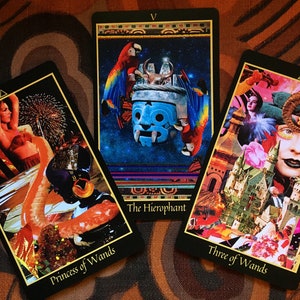 The Princess of Wands, Hierophant and Three of Wands cards from the Telezma Tarot, a hand cut collage Tarot deck. Each card has striking imagery, hold colors and a dynamic composition.