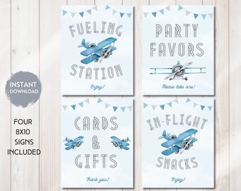 May include: Four printable 8x10 inch signs with a blue airplane theme. The signs say "Fueling Station", "Party Favors", "Cards & Gifts", and "In-Flight Snacks".