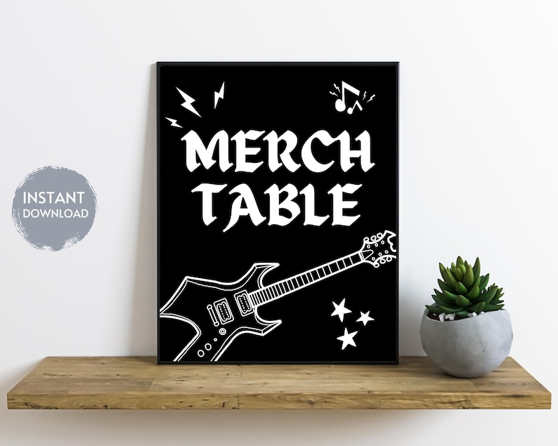 May include: Black and white graphic design with the text "Merch Table" and a stylized electric guitar.