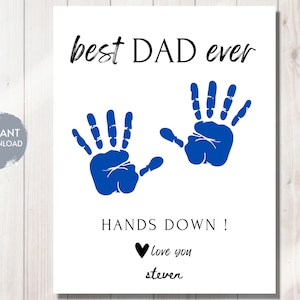 May include: A white card with blue handprints and the text "best DAD ever HANDS DOWN! love you steven".