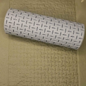 May include: A gray textured roller with a diamond pattern. The roller is used to create a textured surface on clay or other materials.