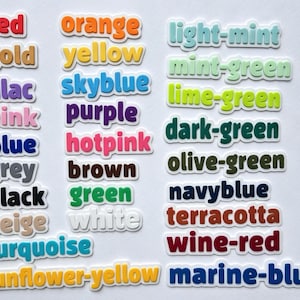 May include: A collection of colorful word stickers, each displaying a different color name. Colors include red, orange, yellow, green, blue, and many more. The stickers have a white border, and the text is in a sans-serif font.
