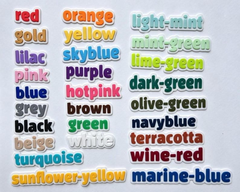 May include: A collection of colorful word stickers, each displaying a different color name. Colors include red, orange, yellow, green, blue, and many more. The stickers have a white border, and the text is in a sans-serif font.