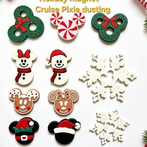 May include: A collection of holiday magnets featuring various designs including green wreaths with red bows, peppermint swirls, snowmen, gingerbread characters, and white snowflakes. The text "Holiday magnet Cruise Pixie dusting" is visible at the top.