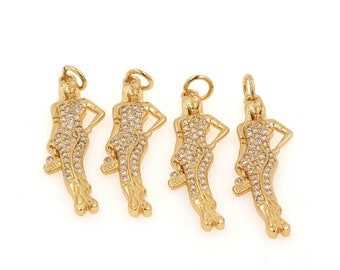 May include: Four gold-tone charms in the shape of a woman, each adorned with clear rhinestones. The charms are perfect for adding a touch of sparkle to jewelry projects.